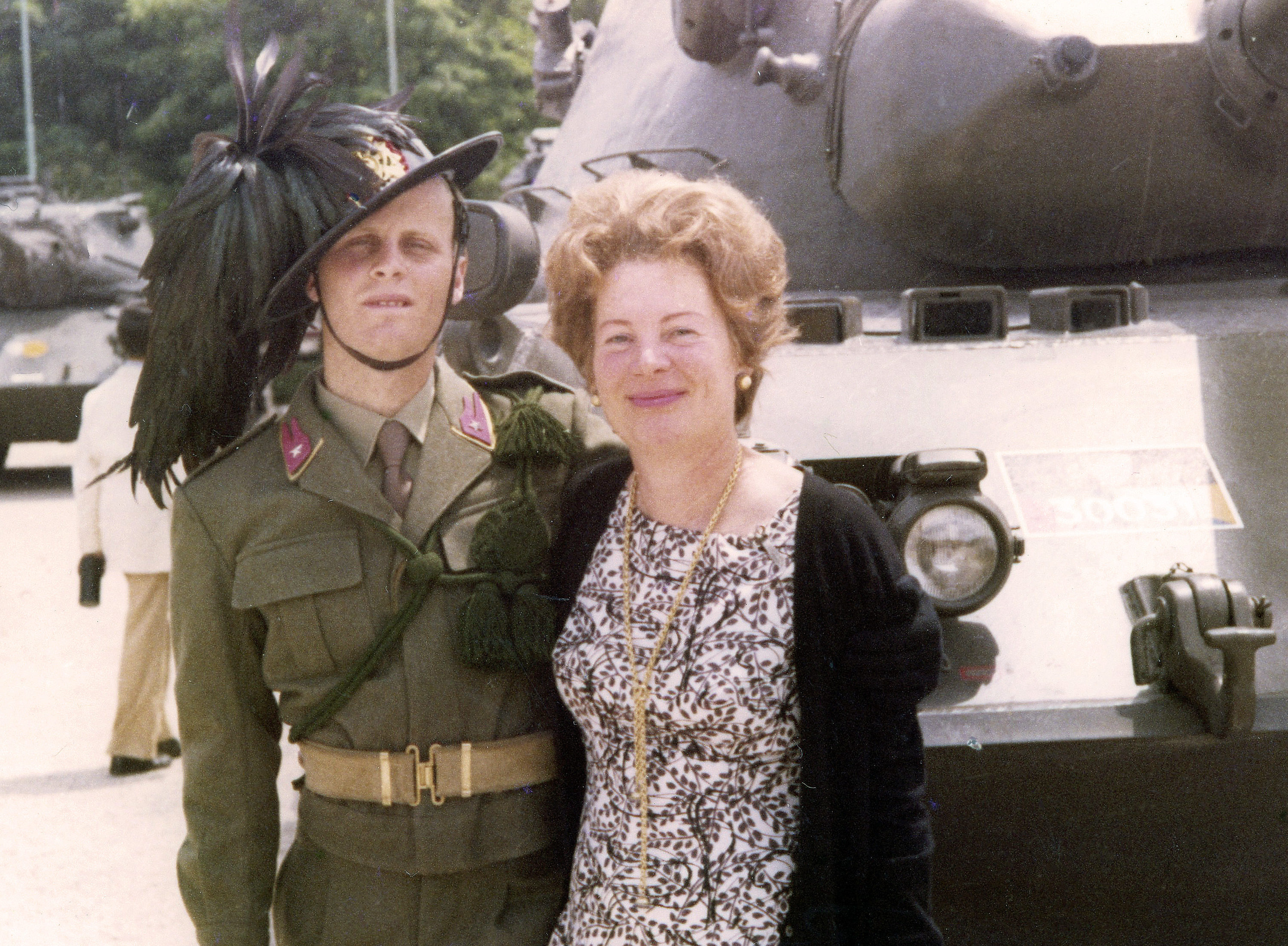 With Mom in front of an older armored tank